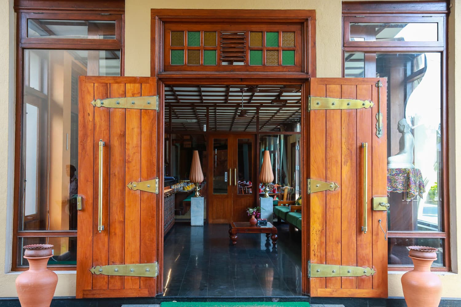 Open lobby entrance with carved doors