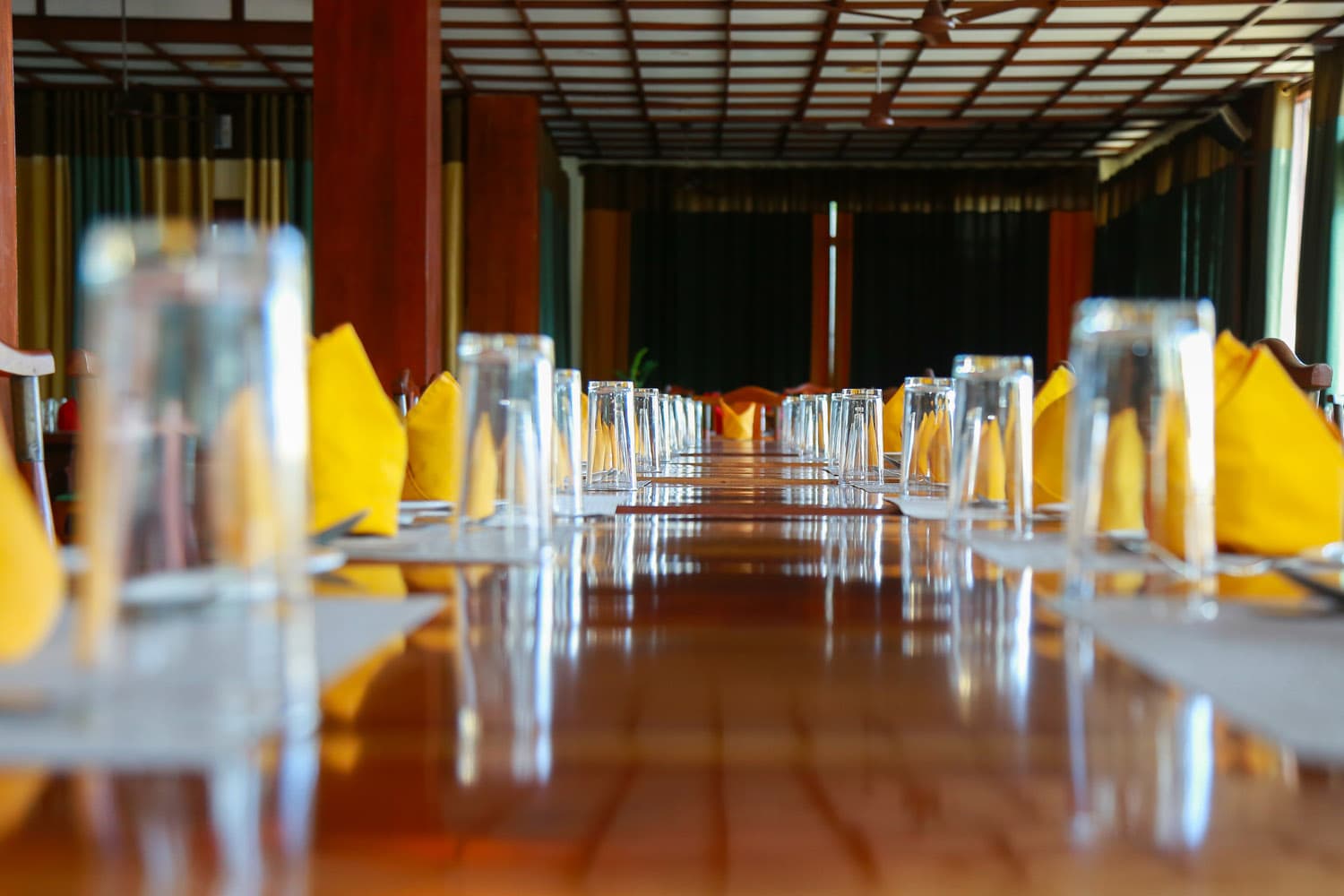 Long dining table set for service