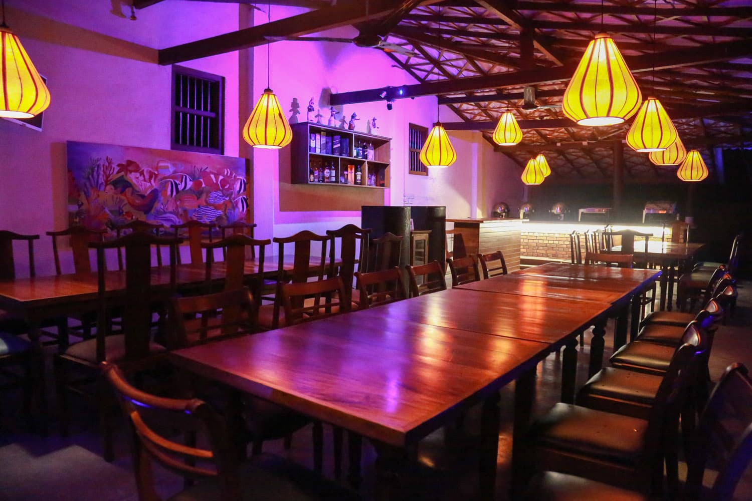 Open-air restaurant glowing at night